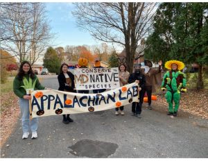 Photo of AL graduate students at the start of the city of Frostburg's Halloween Parade.